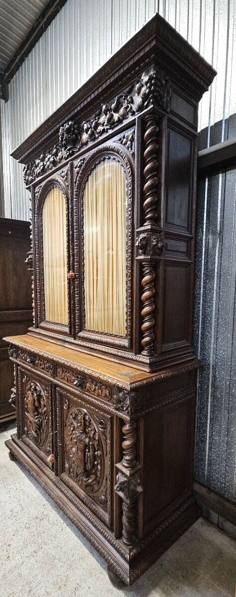 Two-body buffet in solid oak, richly carved in the Renaissance style.