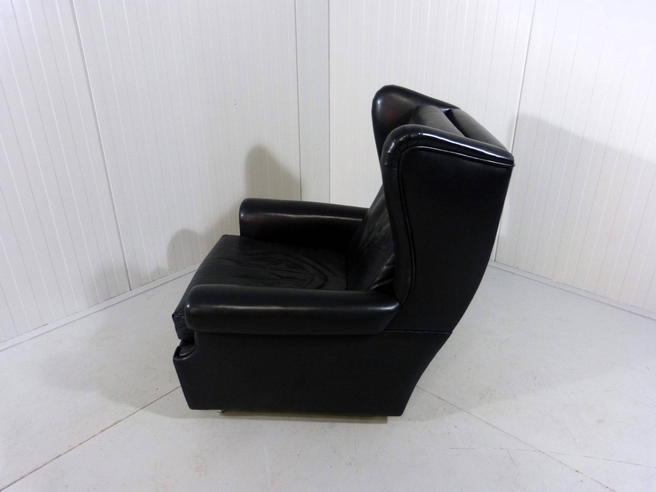 Black leather wingback chair on wheels 1960’s