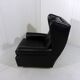 Fauteuil à oreilles en cuir noir sur roulettes années 1960