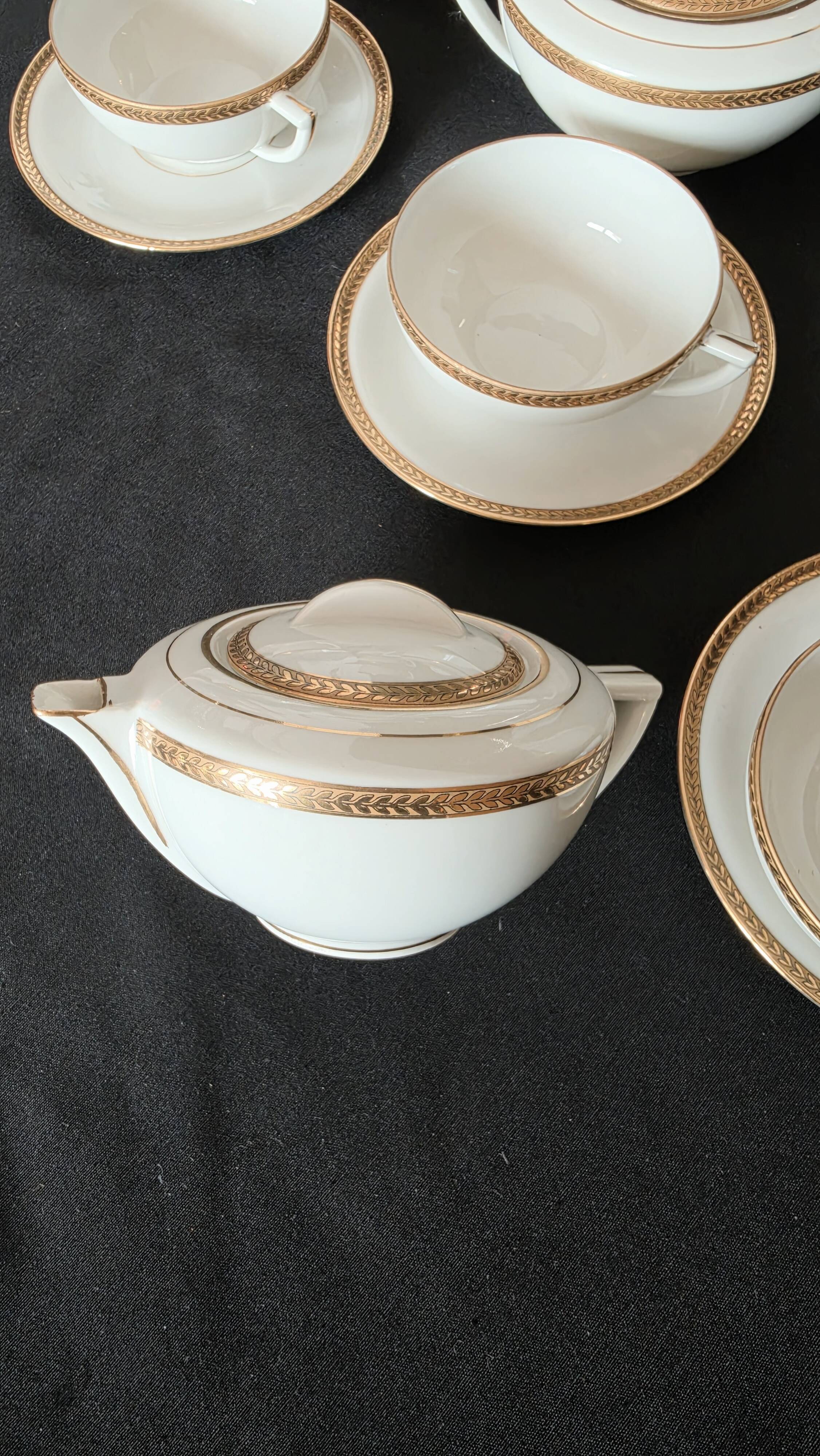 Coffee or tea service in Limoges porcelain and gold, France, Art style.
