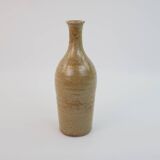 Brown ceramic/stoneware bottle with chiseled floral pattern