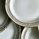 12 Limoges porcelain dessert plates, gold decoration.