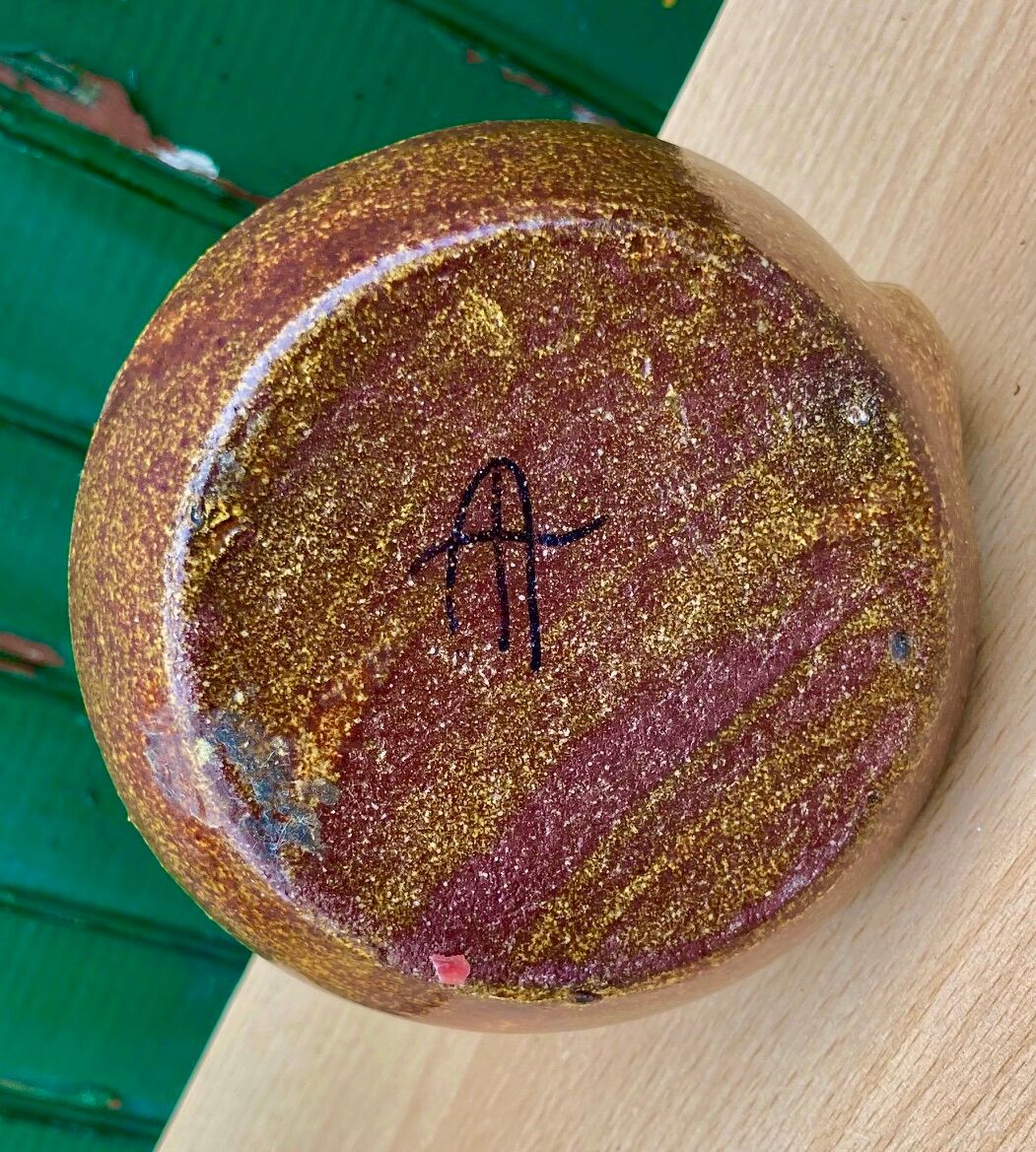 Candle holder in old earthenware signed by the 2 glued aa of the Accolay factory