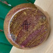 Candle holder in old earthenware signed by the 2 glued aa of the Accolay factory