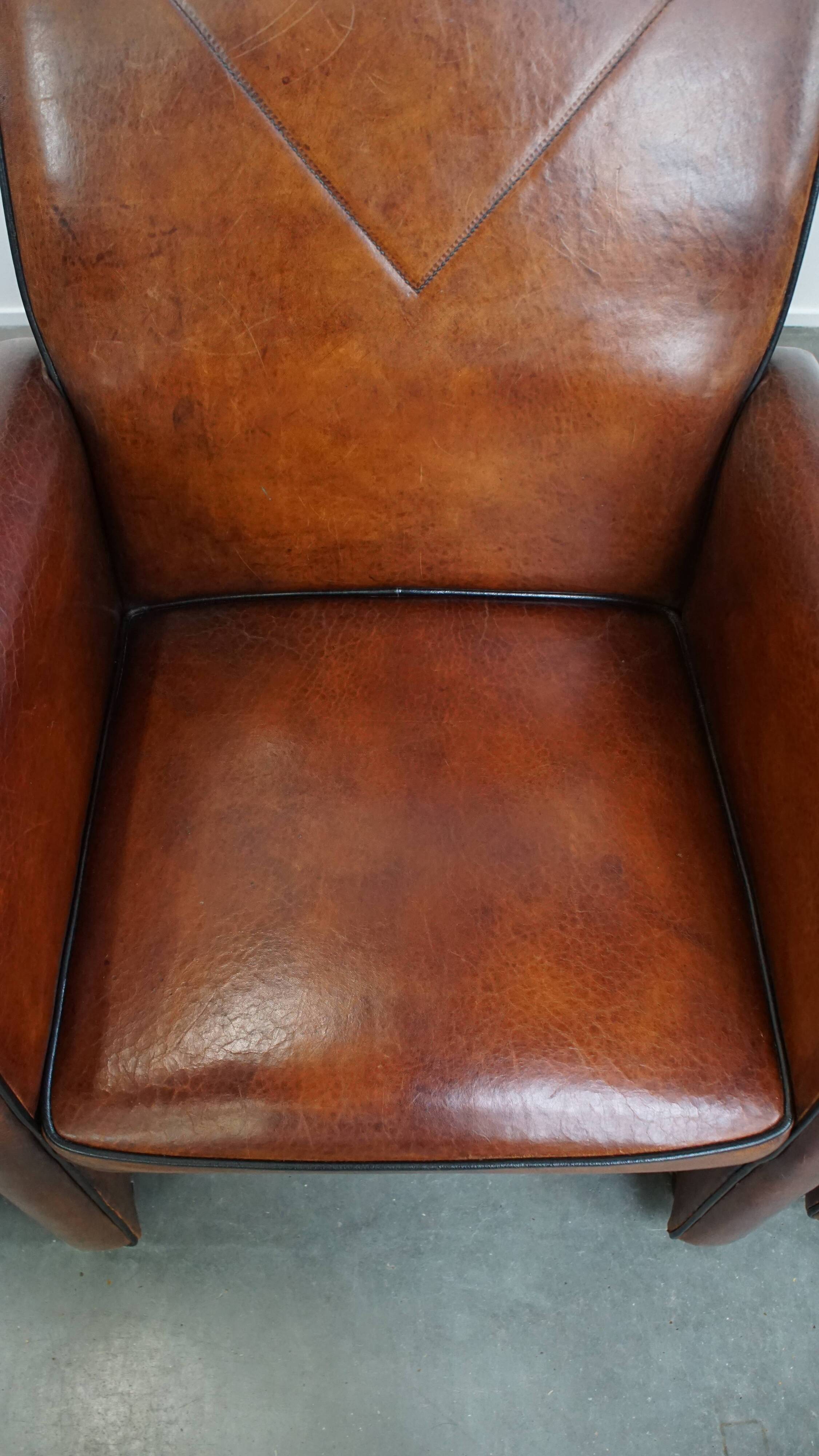 Vintage set of 4 sheepskin leather dining chairs on castors