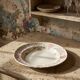 Antique Longchamp service shallow dish with polychrome daisies, ironstone, 19th century.