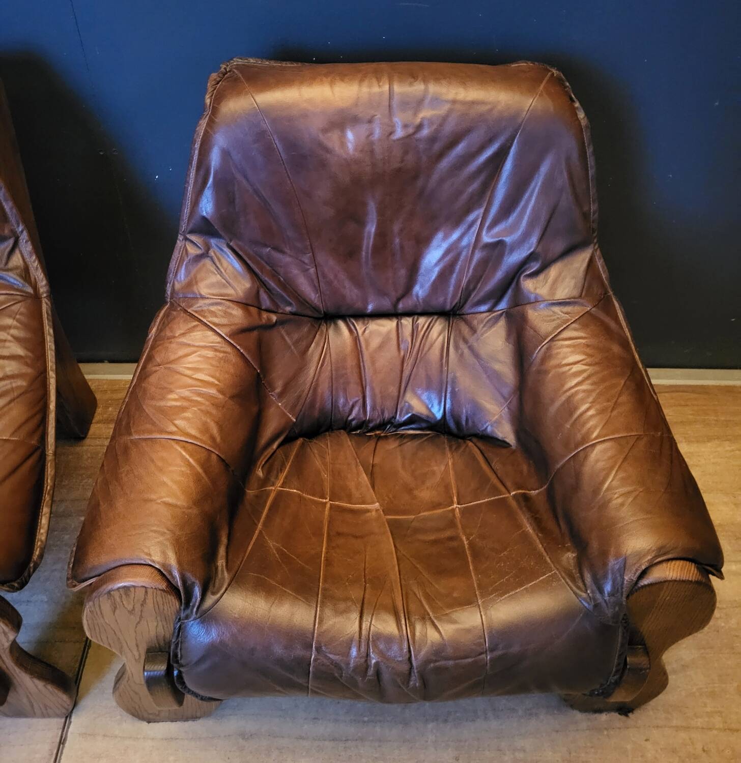 Pair of Vintage Brutalist armchairs from the 60s in leather and solid oak