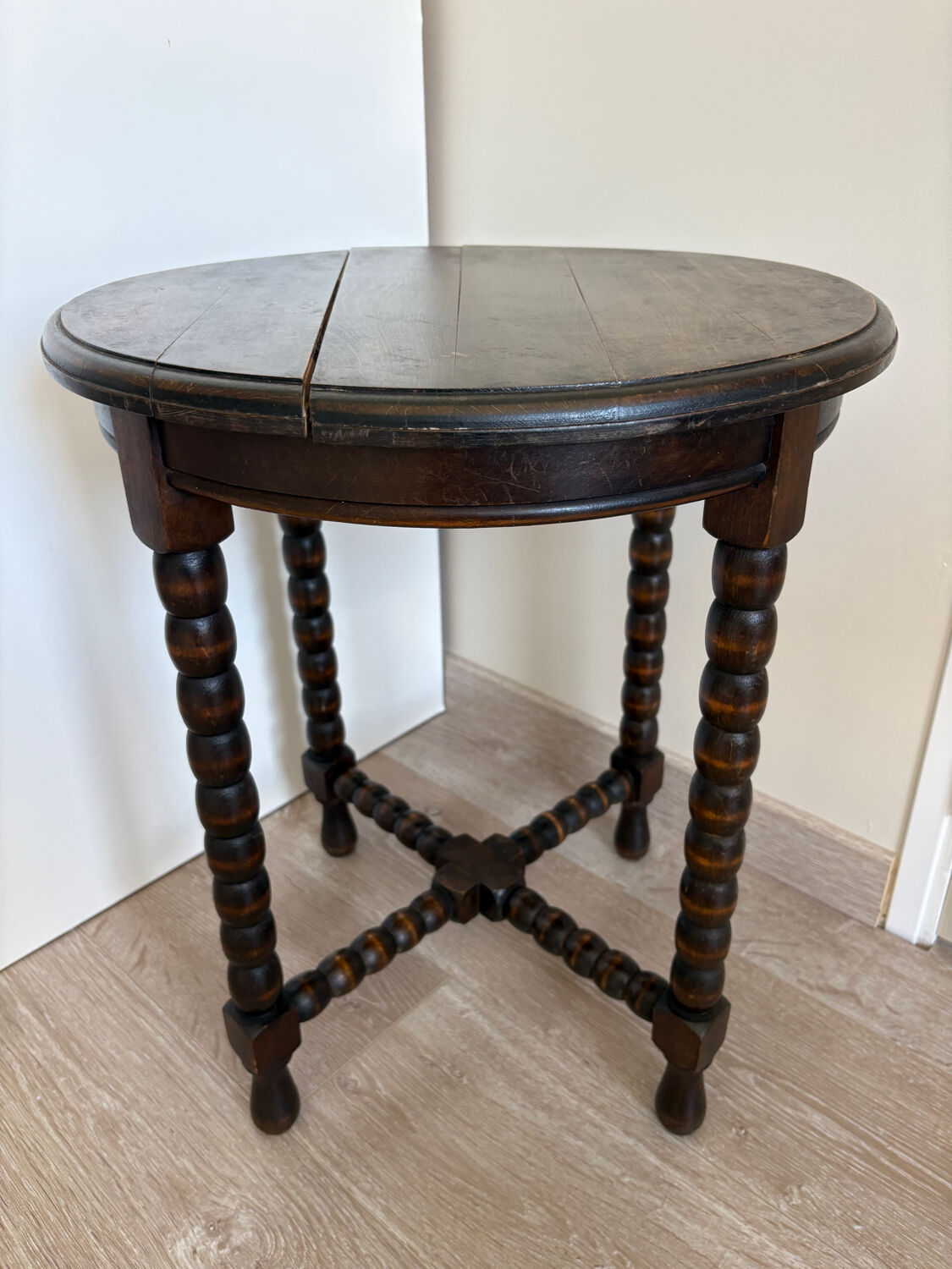 Antique turned wooden side table with authentic charm.