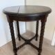 Antique turned wooden side table with authentic charm.