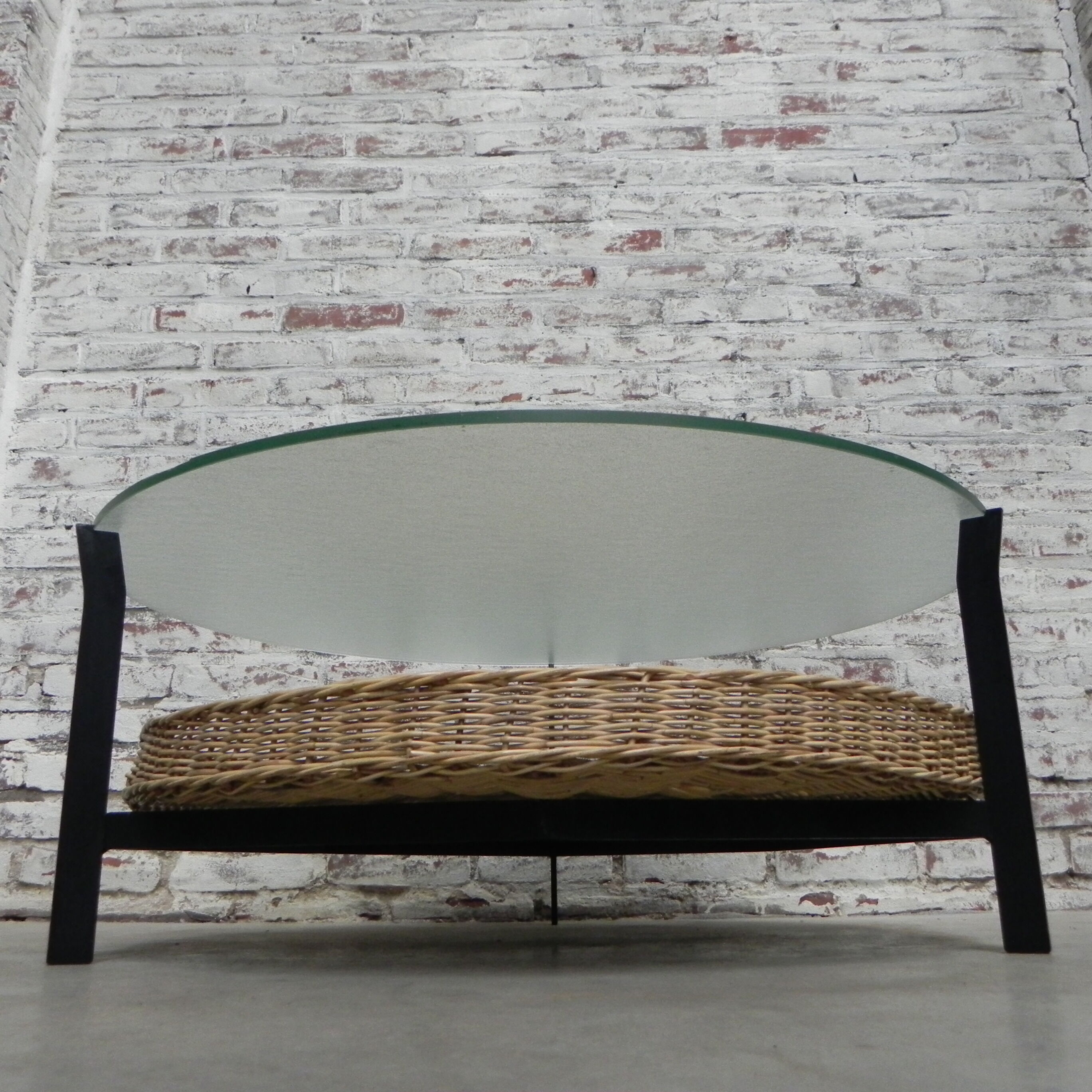 Vintage coffee table with glass top and rattan basket