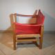 Wood and red leather armchair 60