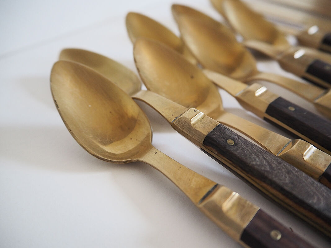 Set of old dessert cutlery in wood and brass
