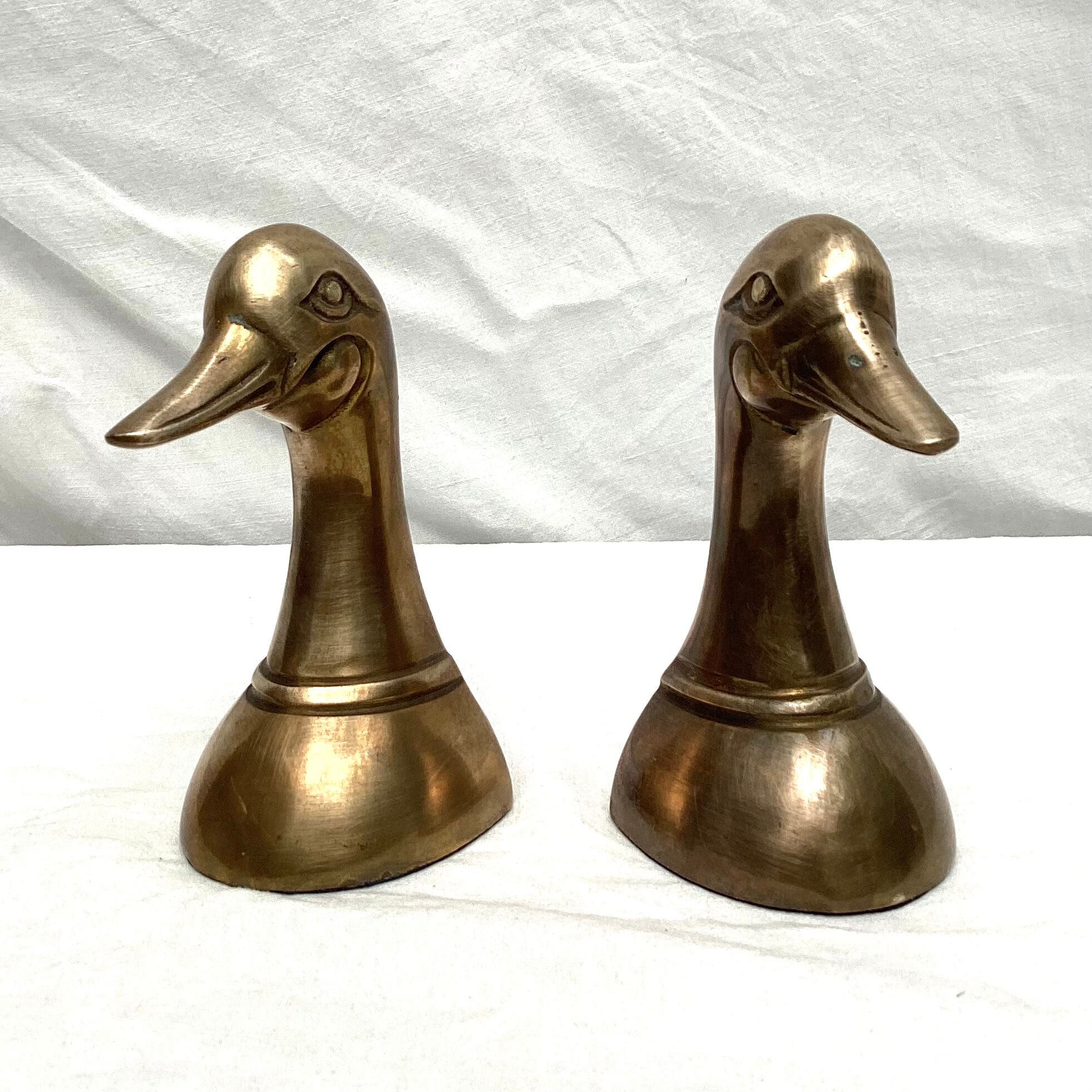 Paires de serres livres têtes de canards en laiton