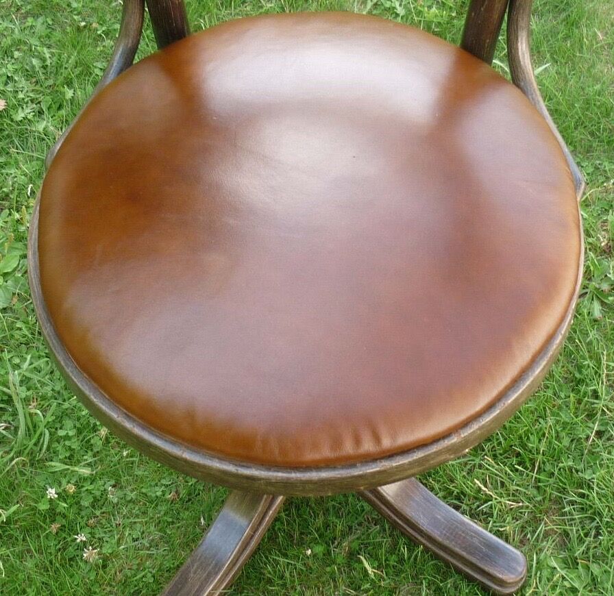 Swivel leather armchair