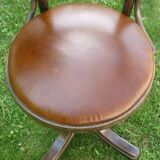 Swivel leather armchair