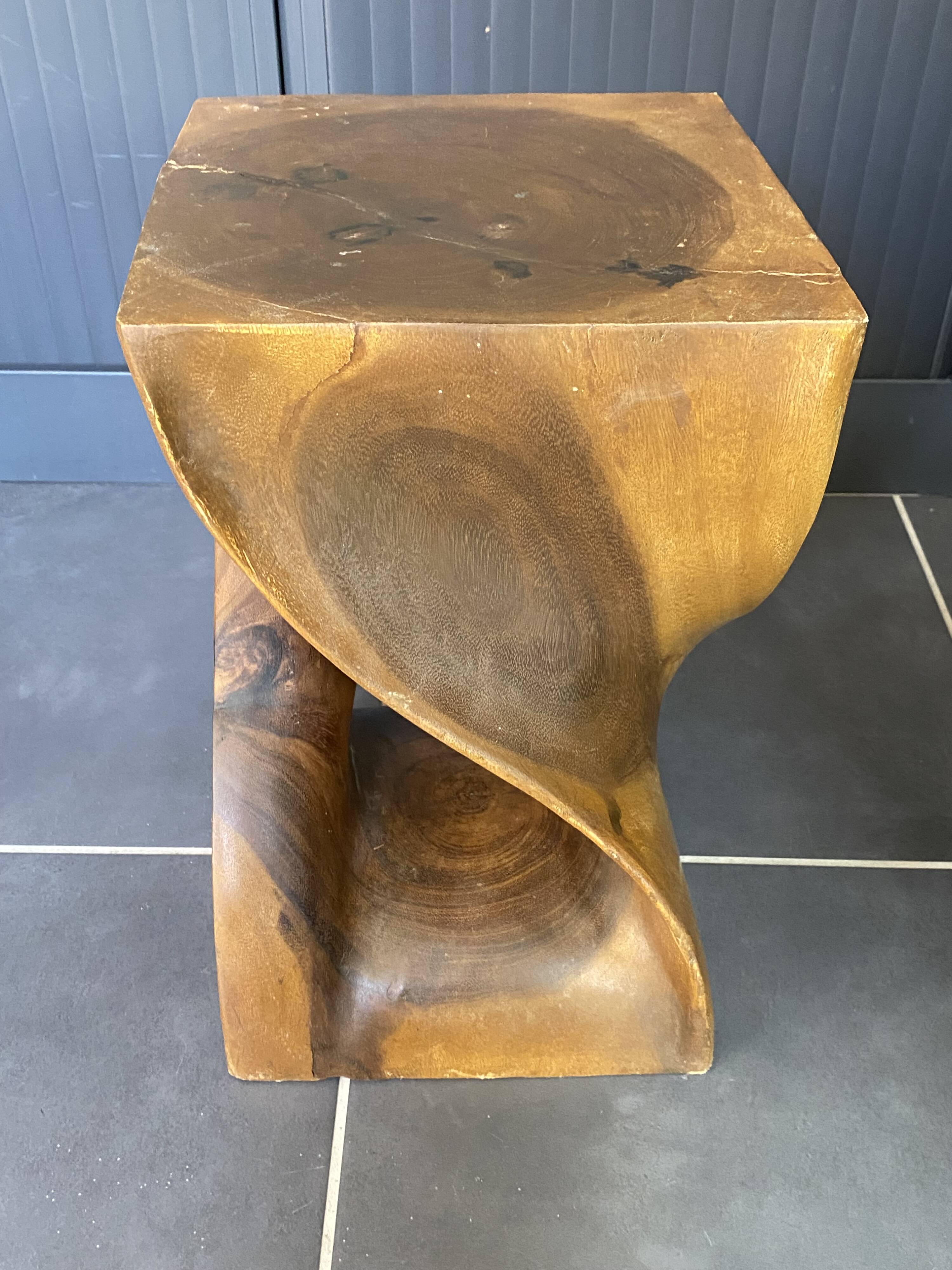 Stool n2 in solid raw walnut wood carved from the mass 1970