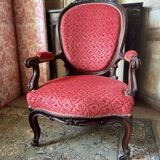 Napoleon III medallion armchair in carved wood and red velvet.
