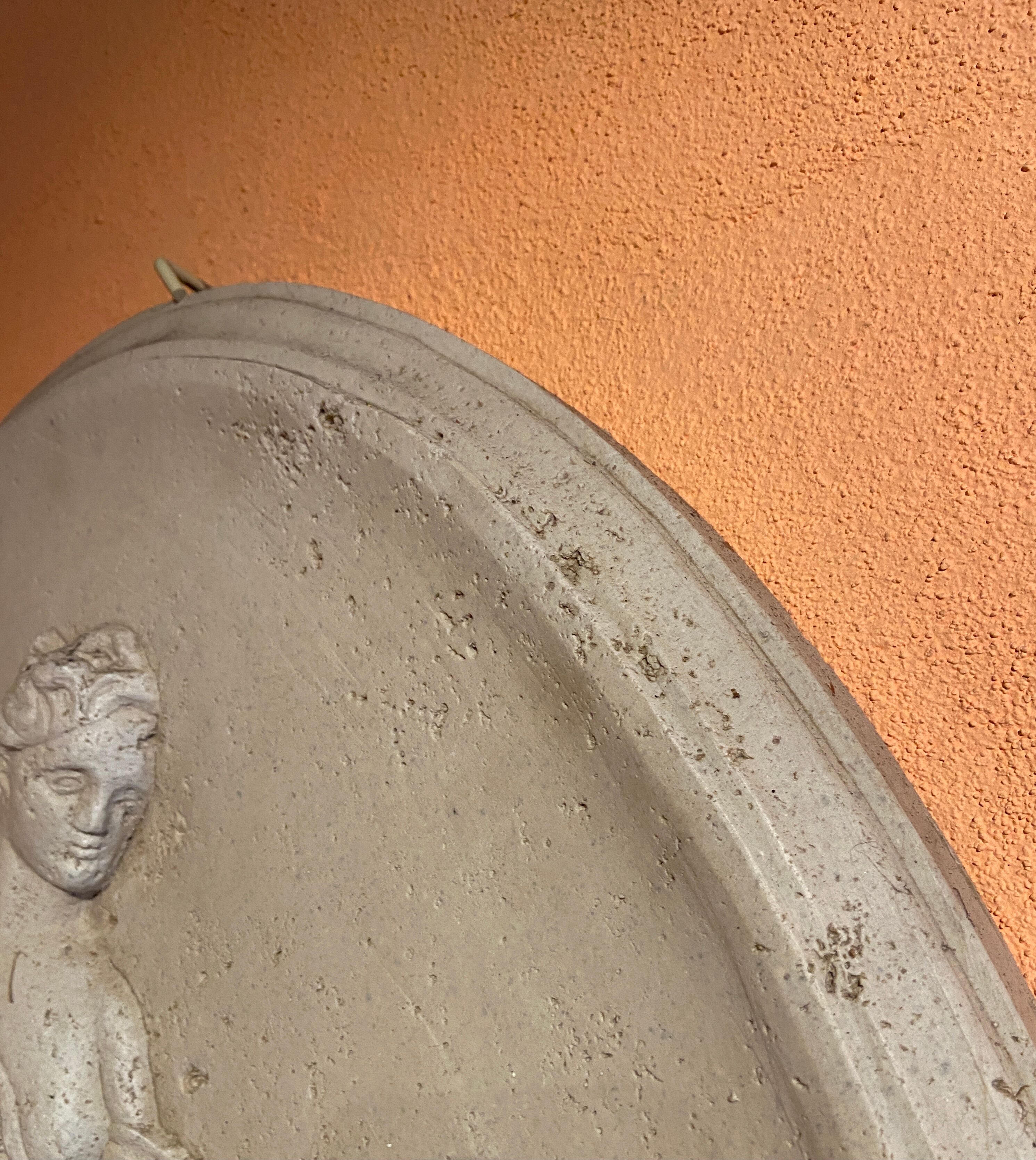 Imposing Oval bas-relief style Antique Italian travertine