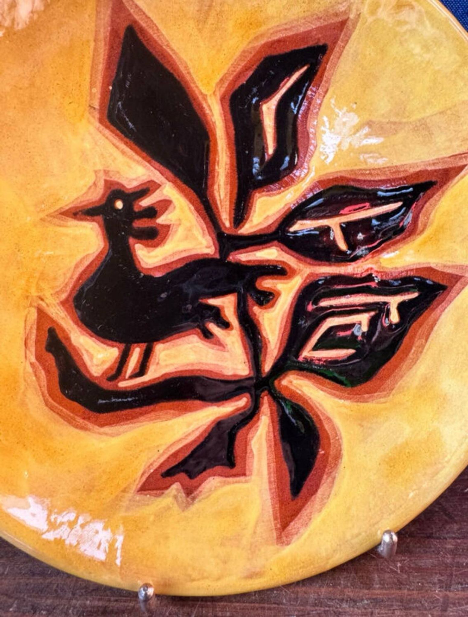Terracotta plate, Jean Lurçat decorated with a rooster and foliage.
