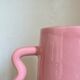 Handmade abstract corrugated handle pink ceramic vase