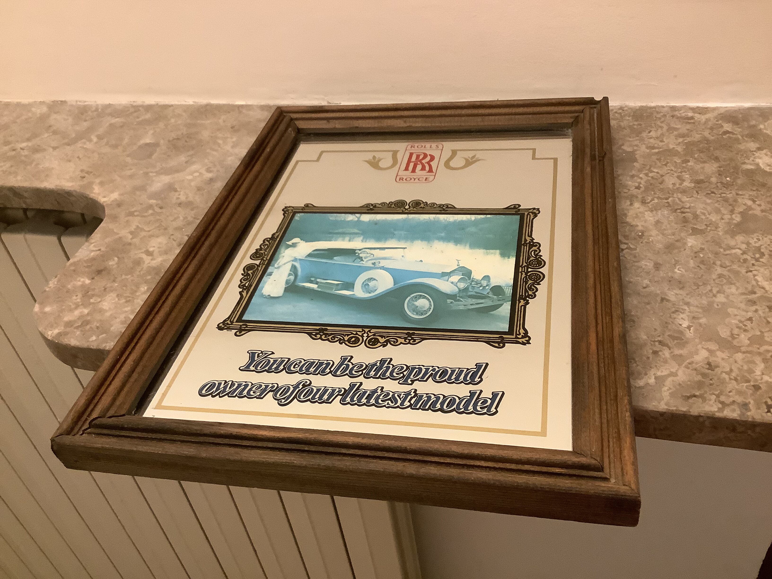 Mirror illustration of old Rolls Royce car