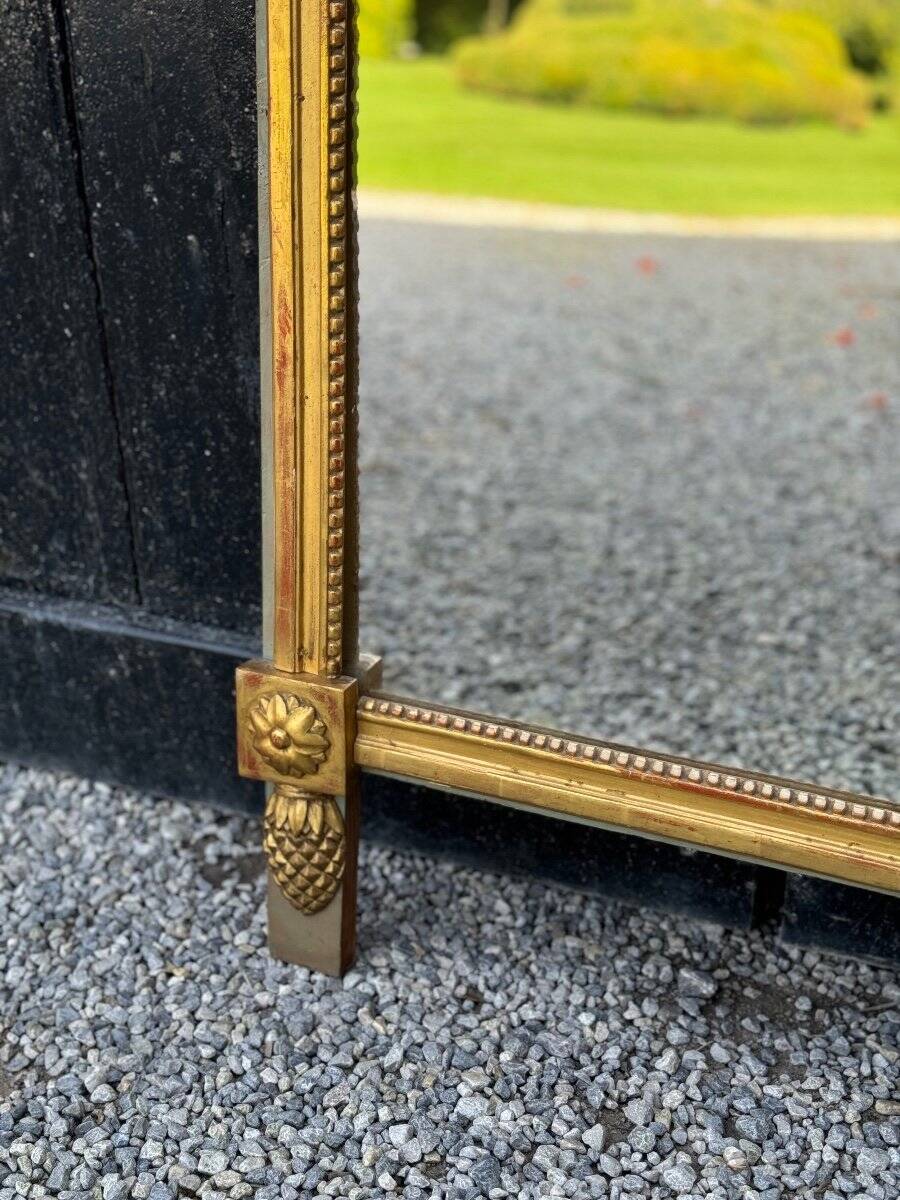 Louis XVI carved and gilded wood mirror, late 18th century
