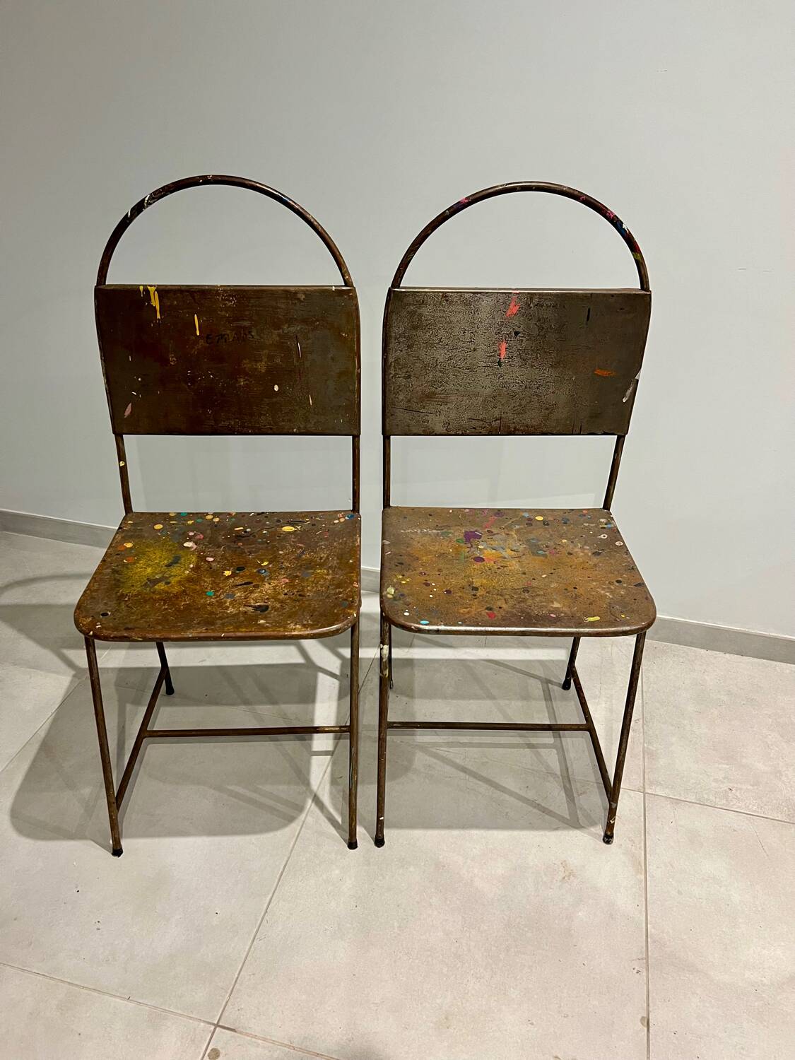 Pair of vintage raw metal chairs