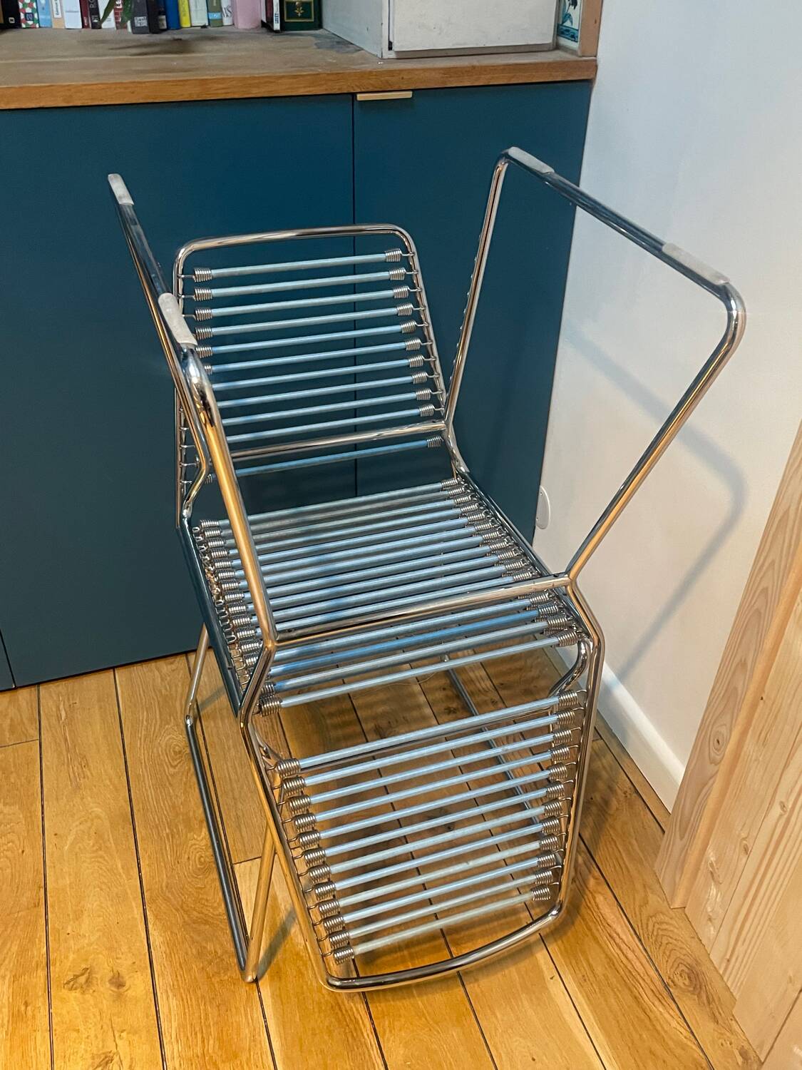 2 metal chairs with bungee cords