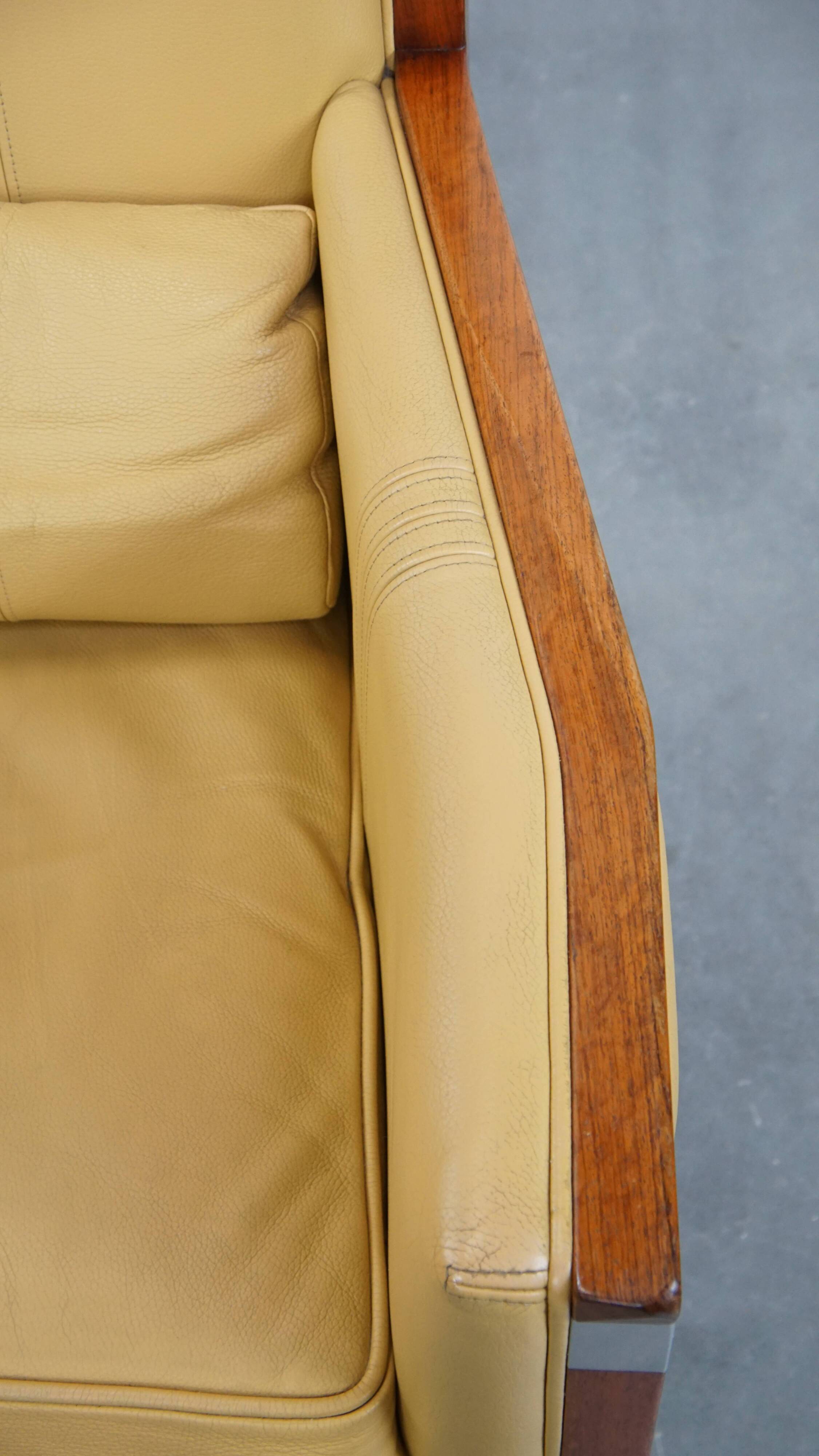 Art Deco armchair in yellow leather with high back