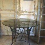 Table ronde pieds métal et verre fumée