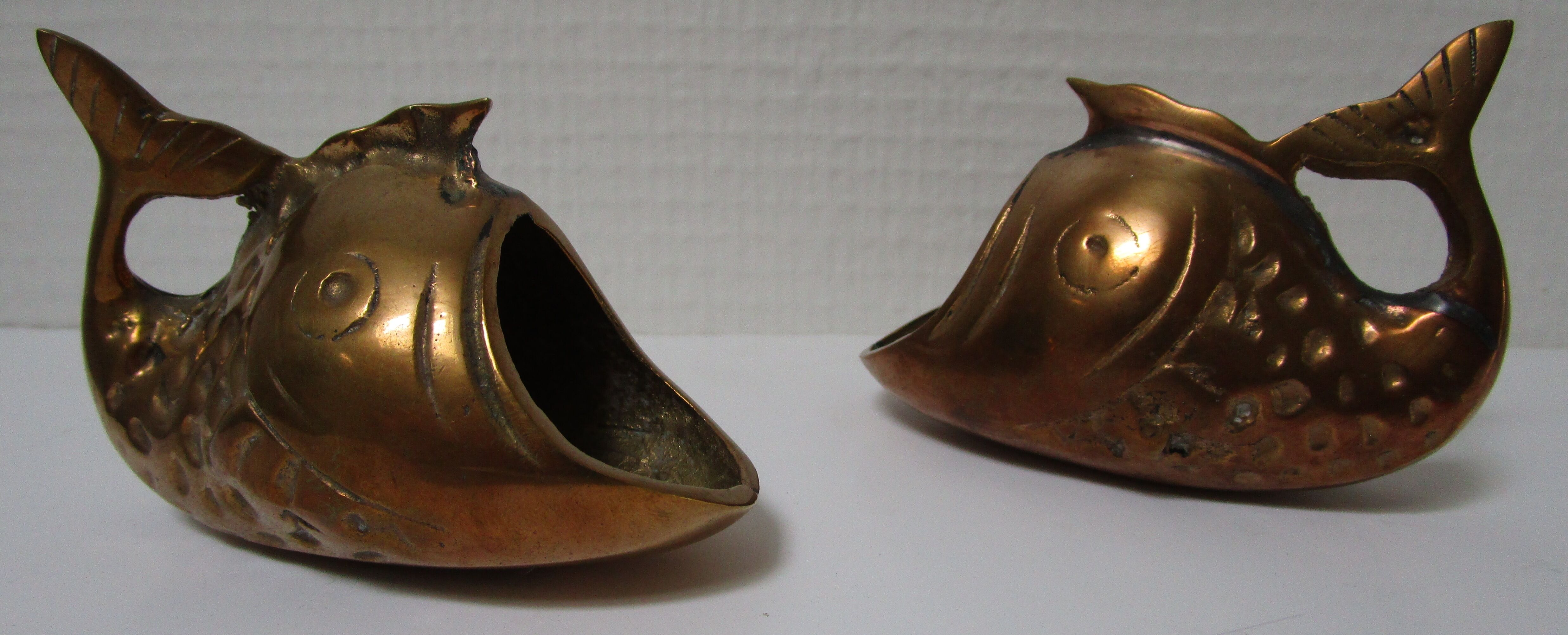 Two vintage brass fish ashtrays