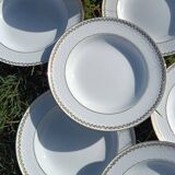 Twelve white porcelain plates