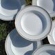 Twelve white porcelain plates