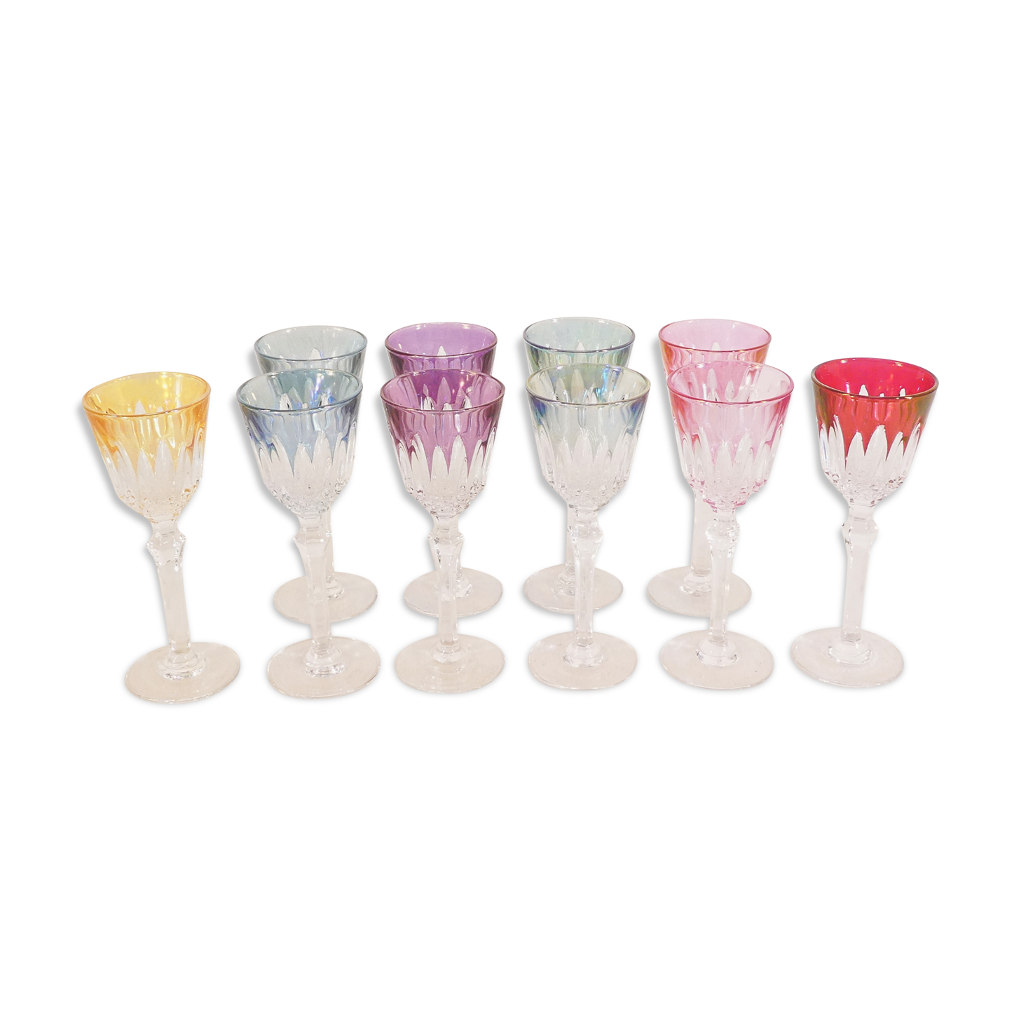10 glasses with coloured liquor