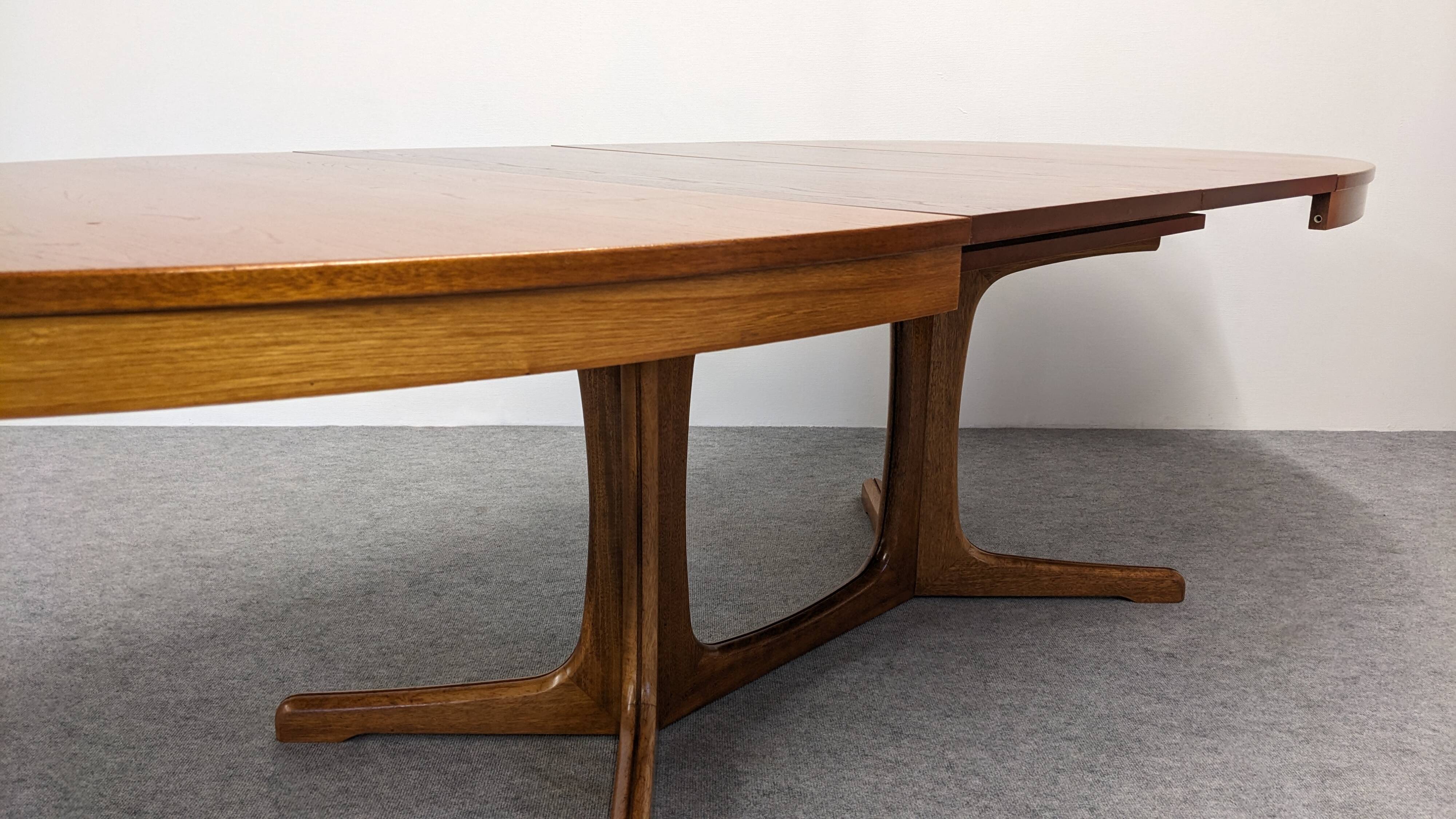 Oval extendable dining table by Baumann, France circa 1970.