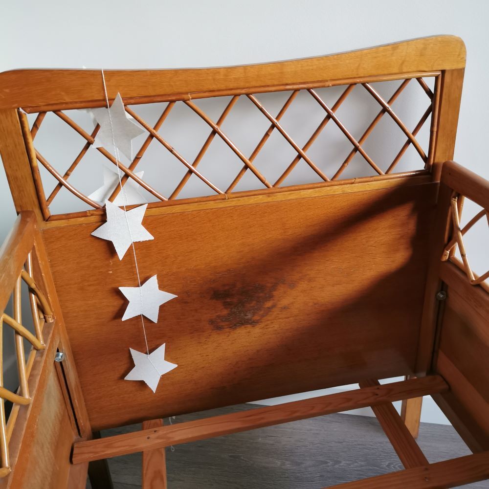 Rattan bed with compass feet