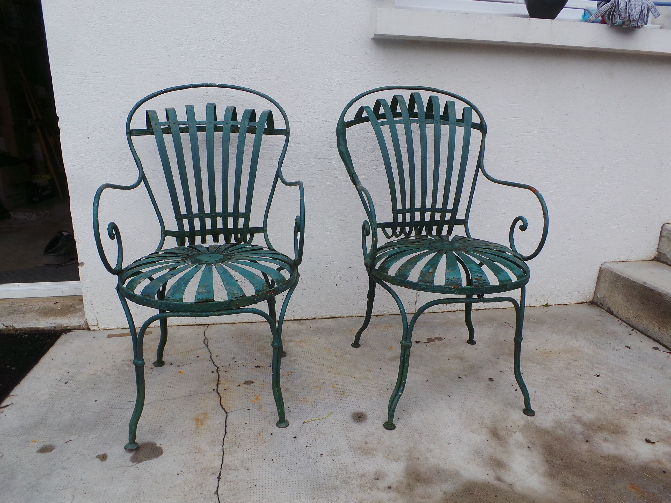 Pair of wrought iron garden chairs by François Carre