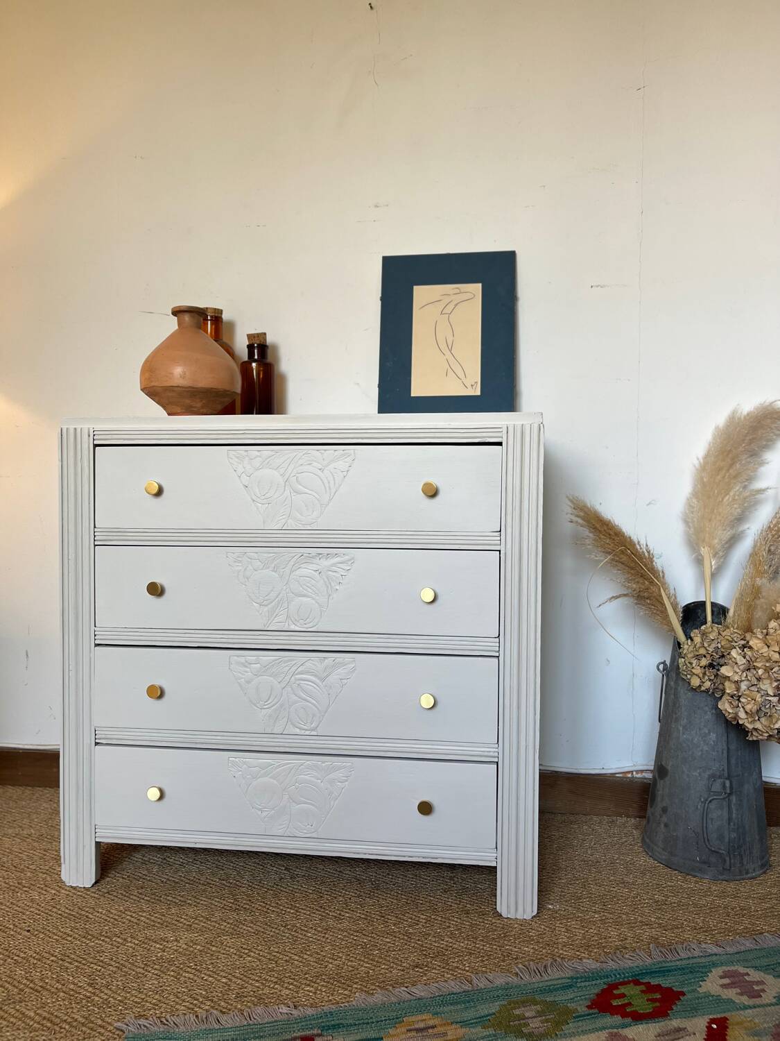 Restored wooden art deco chest of drawers with gilded handles