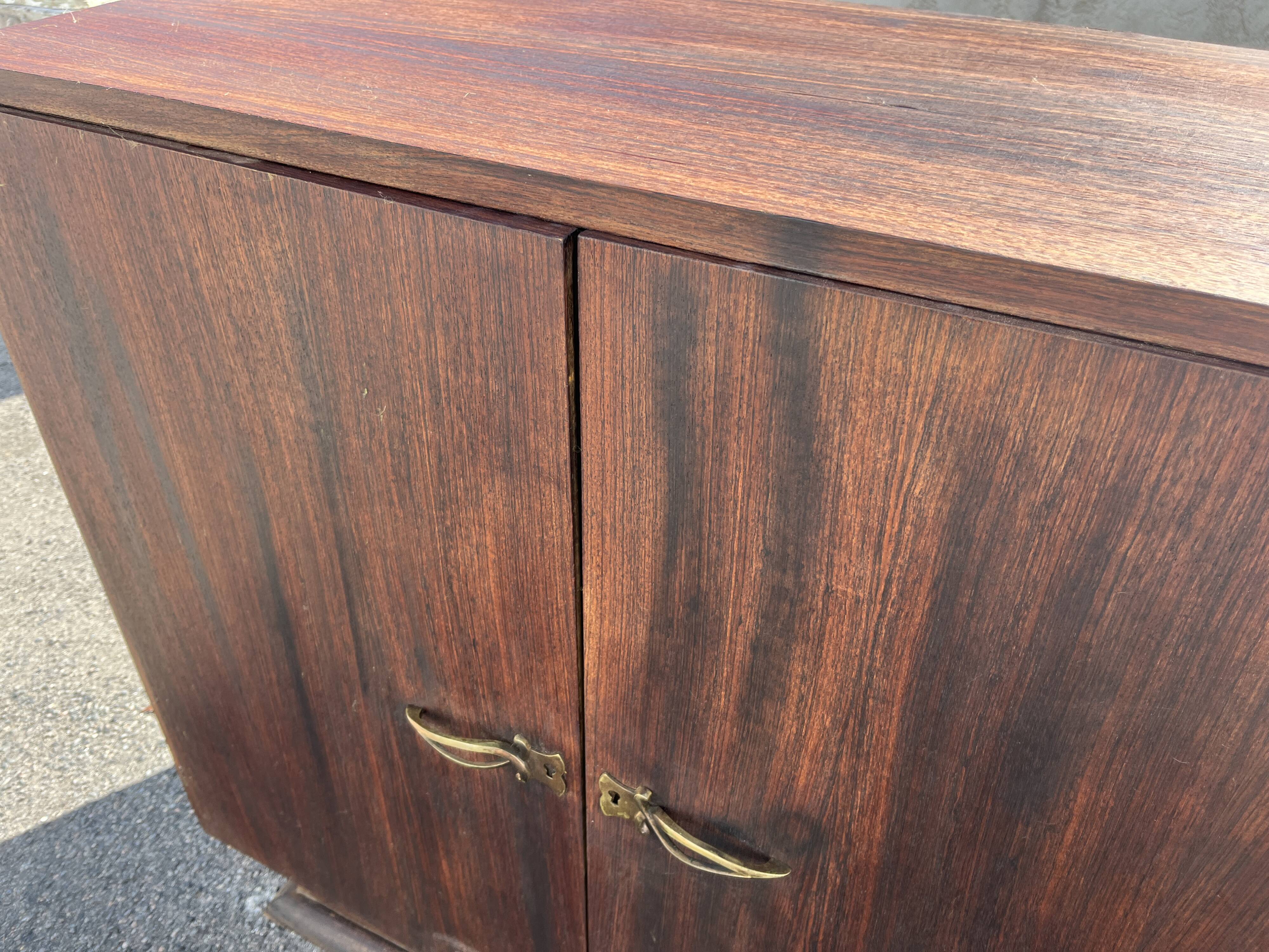 Asymmetrical antique Art Deco sideboard in rosewood veneer.
