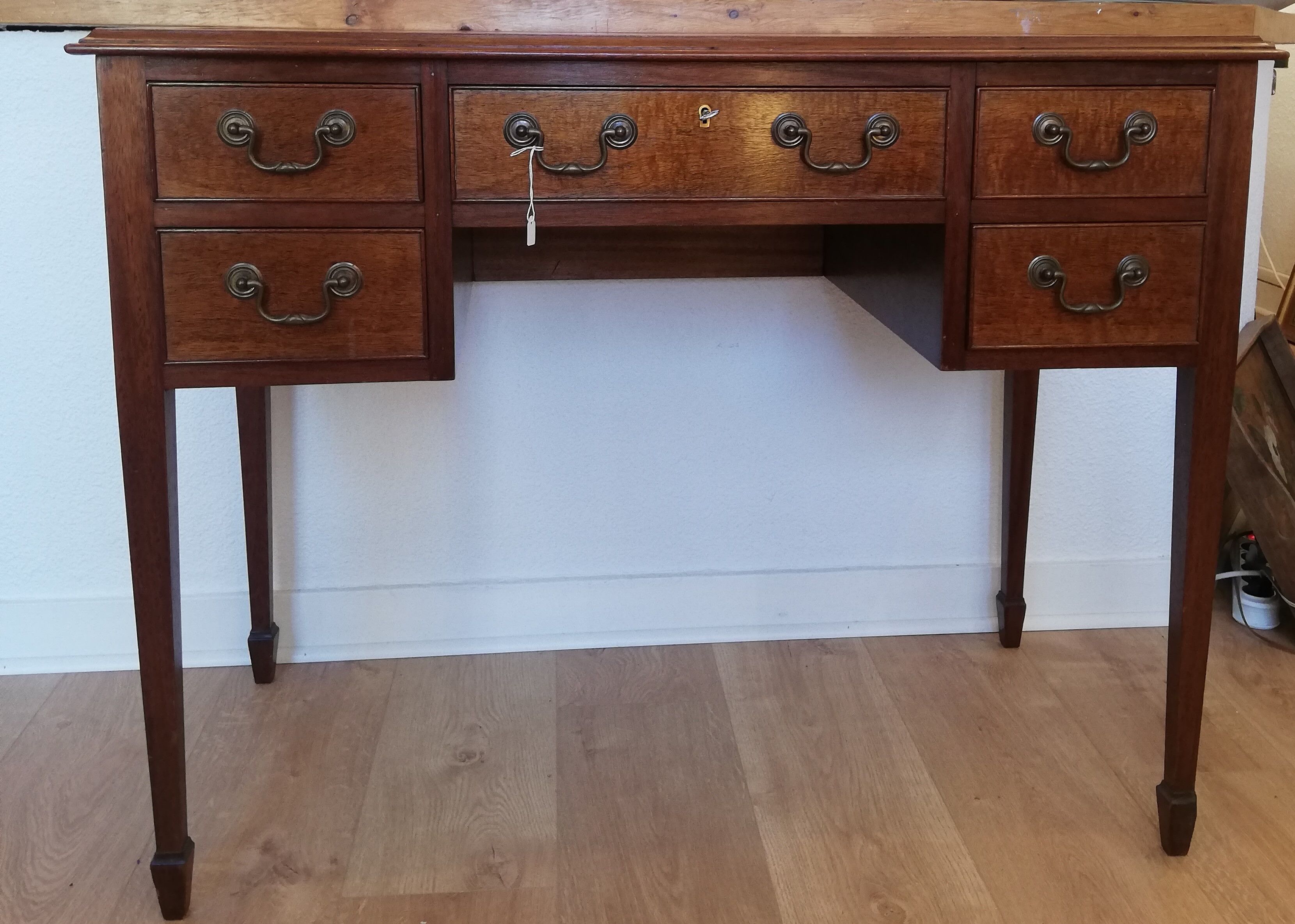 English wooden desk on top of leather