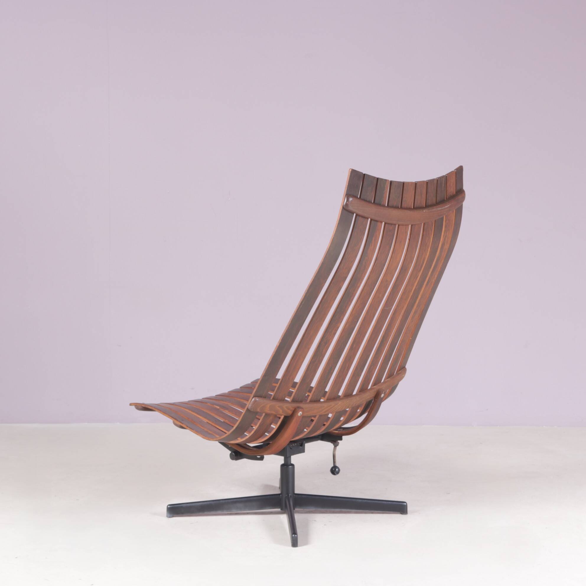 Lounge chair Rosewood with black metal cross base Hans Brattrud 1960s