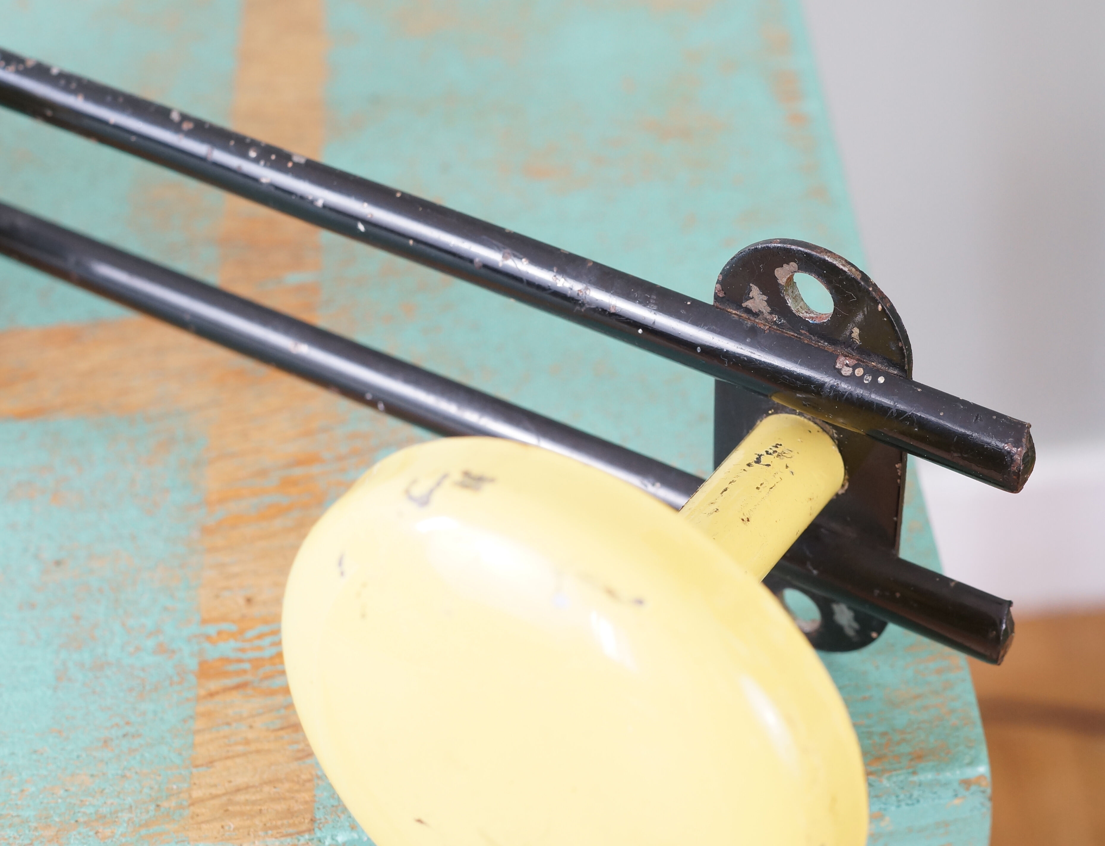 Yellow and black enamelled metal hook, 60s