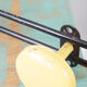 Yellow and black enamelled metal hook, 60s