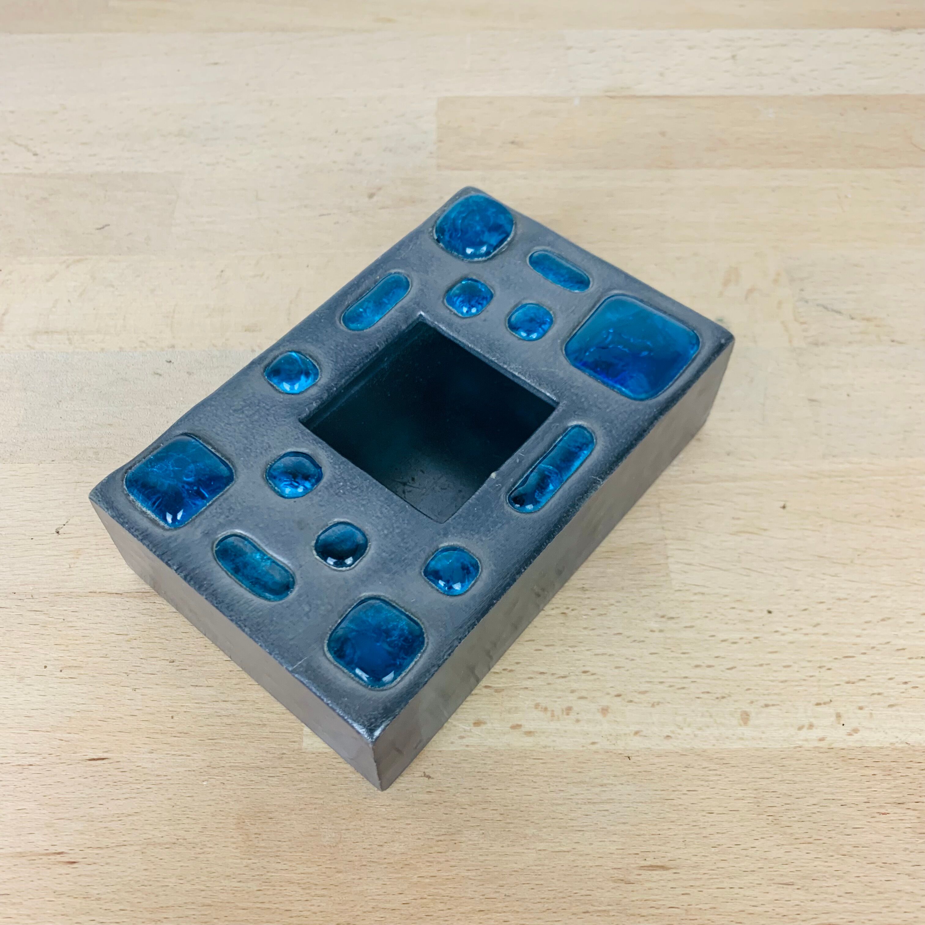 Decorative metal box and blue glass