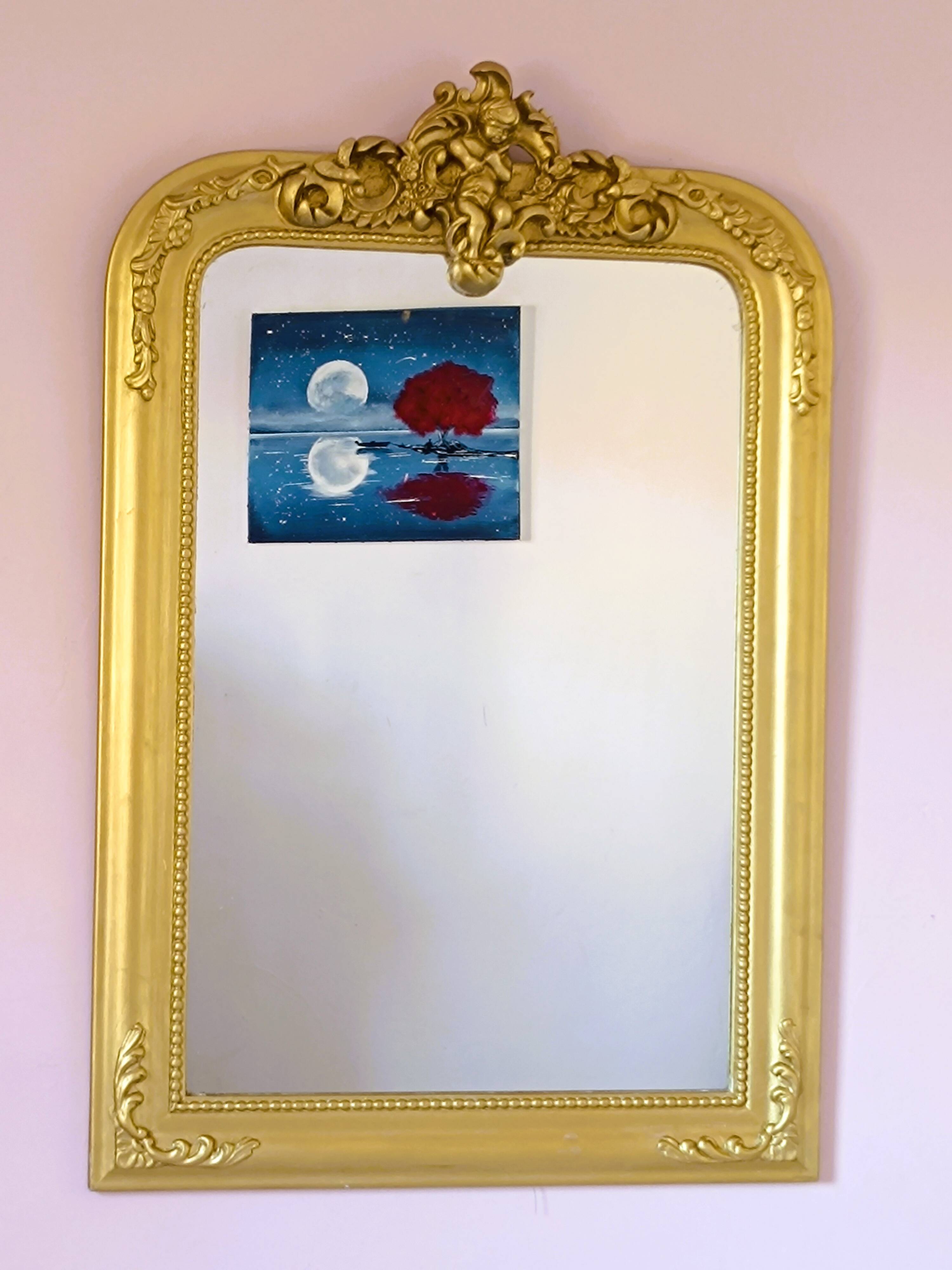 Gilded mirror with a Louis Philippe style pediment