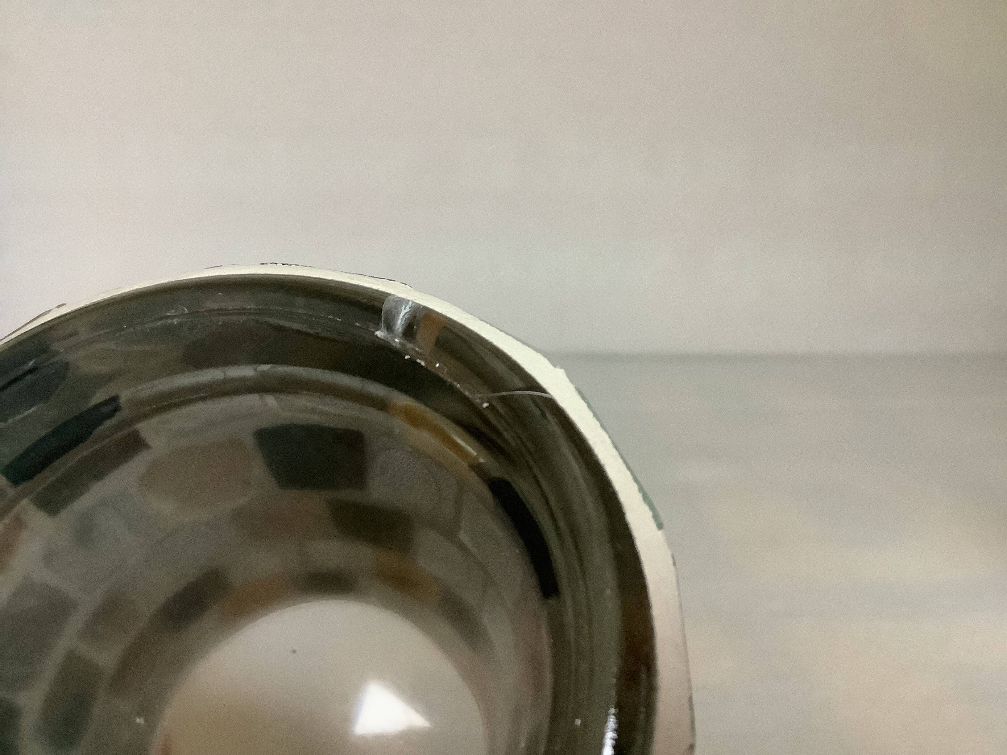 Four mosaic mirror and mother-of-pearl candle holders.