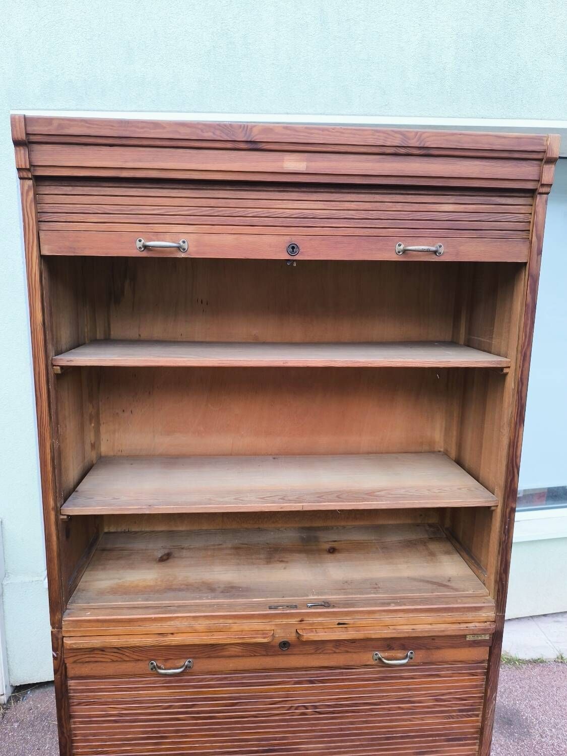 Vintage 1940s secretary desk with wooden curtains, storage, and shutters.