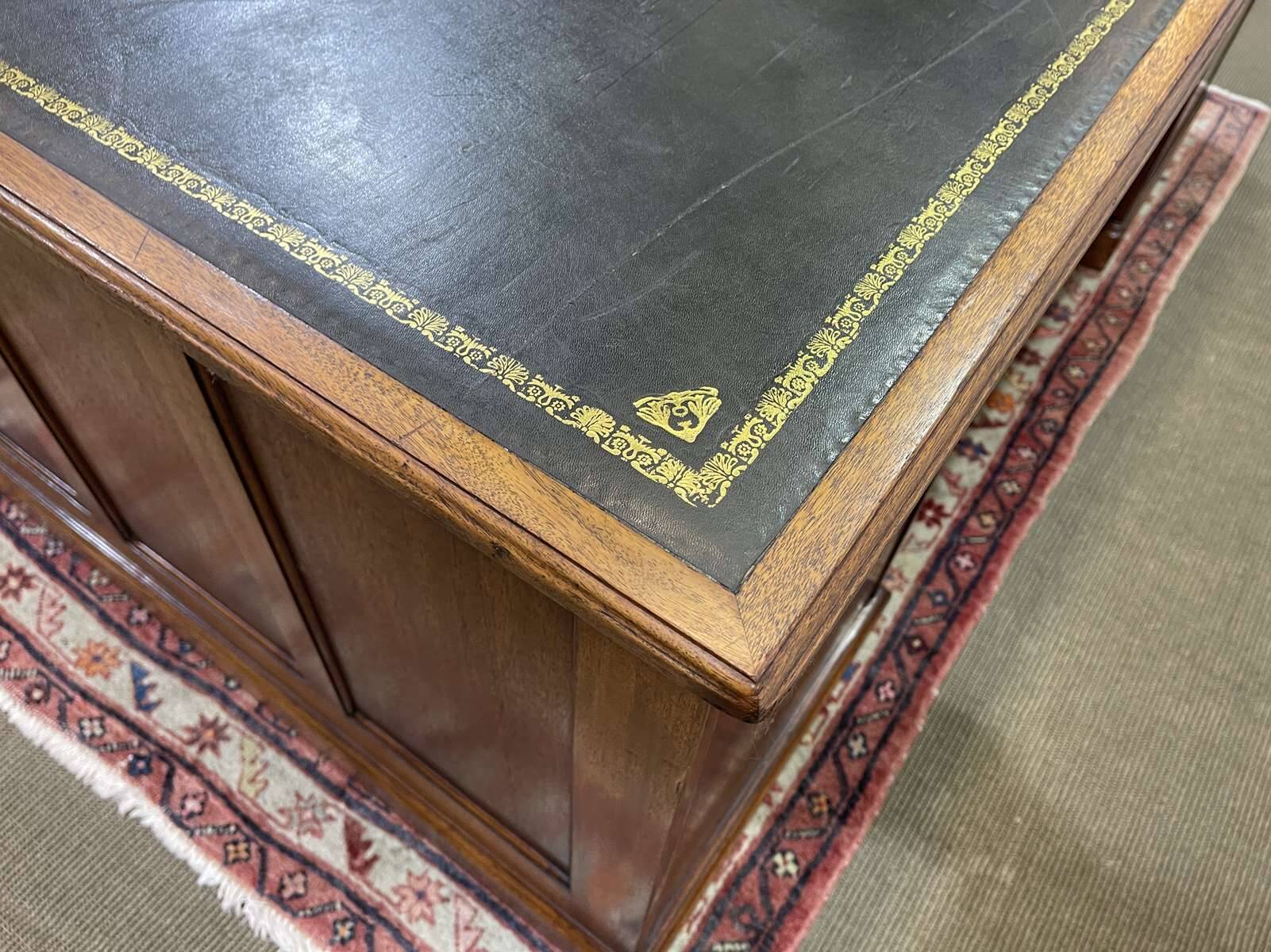 Large English flat desk in mahogany with leather top, early 20th century