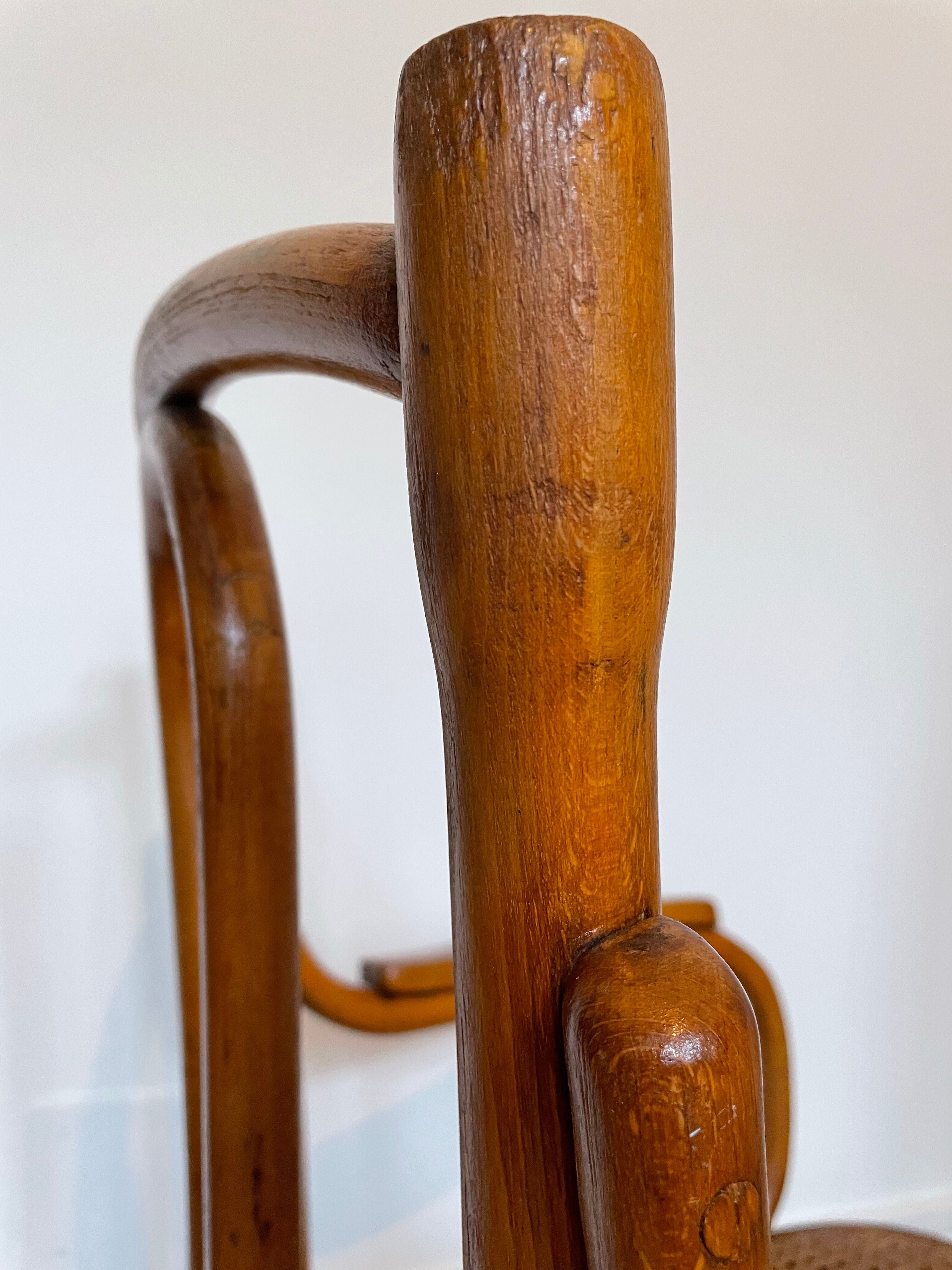 Old thonet armchair in curved wood and rattan cane