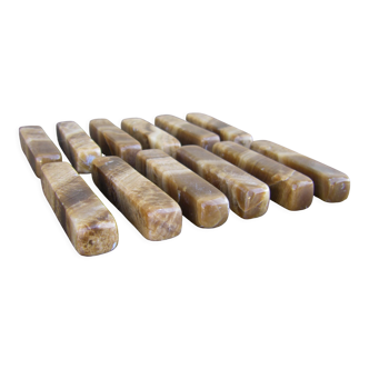 Twelve knife holders in onyx stone